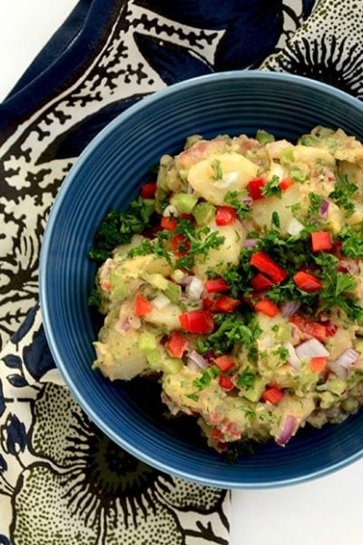 Take your picnic from boring to wow with this Colorful Potato Salad recipe. Fresh veggies, herbs and spices make this salad pop. | vintagekitty.com