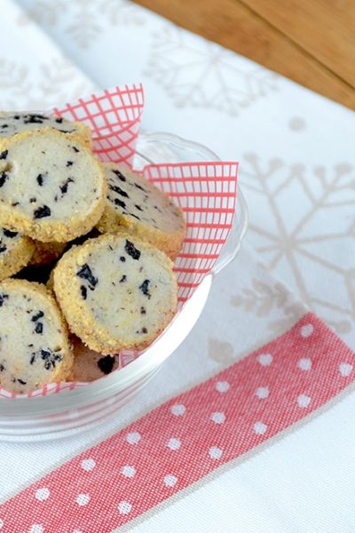 Blueberry Lime Shortbread is a great holiday icebox cookie. It's filled with dried blueberries and lime zest giving it a fresh, zippy flavor and coated in an almond cornmeal crumb for added texture and crunch. | vintagekitty.com