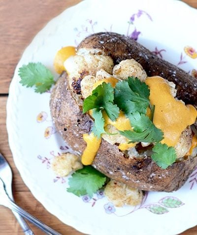 Aloo Gobi Baked Potatoes, a new twist on the classic Indian dish. Great for weeknights and easy to prep in advance, this recipe will become a fast favorite!