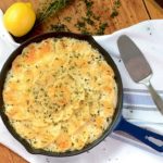 Lemon Thyme Potatoes au Gratin are filled with savory, sharp lemon flavor. This dish is also creamy and loaded with fresh garlic, thyme and Parmesan cheese making it a rich and complex side dish. | vintagekitty.com