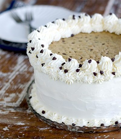 This Chocolate Chip Cookie Cake will blow your mind! Layers of cookie flavored cake alternating with vanilla bean, browned-butter chocolate chip cookies and fluffy, vanilla buttercream!