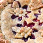 This Magnificent Mixed Berry Pie is the star of summer! Its buttery almond crust highlights summer's abundance of berries. Tender, flaky, and fruity!