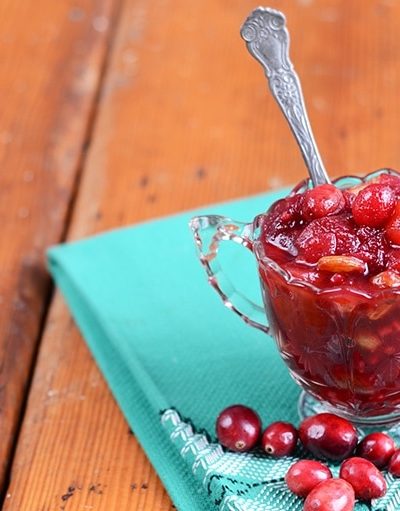 Warm spices are combined with golden raisins, apple and onion to make this delicious Cranberry Chutney. It's a holiday must have condiment that is naturally vegan and gluten free, but pairs well with many foods from cheese to turkey.