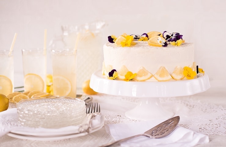 Cake decorating with blueberry and blackberry with rosemary. Cake shop  concept. Wedding cake close-up. Birthday cake Stock Photo - Alamy