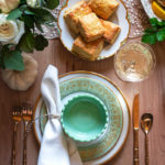 cornmeal biscuits above a china place setting